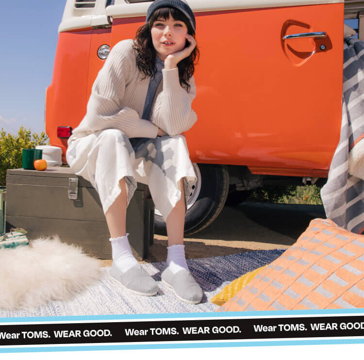 Model sitting and wearing Alpargata Heritage Canvas in morning dove shown.