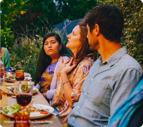 People eating and talking at our impact partner, The Dinner Party.