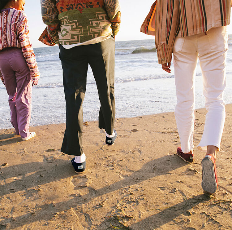 Models wearing Alpargatas at the beach.